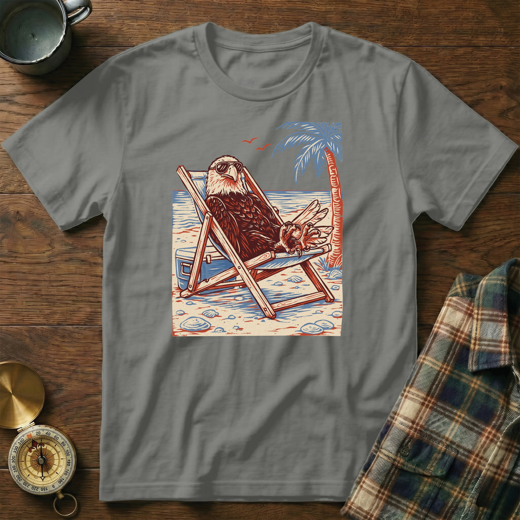 Eagle in sunglasses relaxes in a beach chair with a palm tree on a tropical beach.