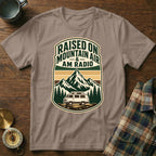 T-shirt with "Raised on Mountain Air & AM Radio" text and mountain van graphic.