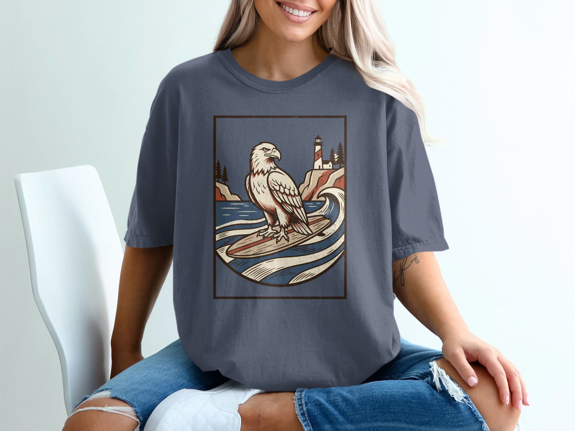 Eagle surfing with lighthouse and trees on a rocky coast.