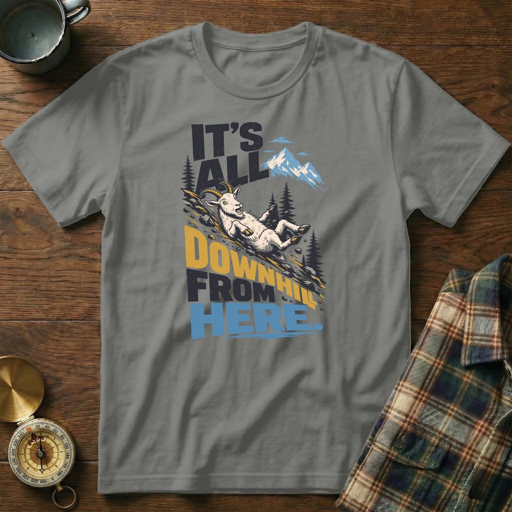 A gray t-shirt featuring a graphic of a mountain goat sliding downhill and the text It's All Downhill From Here.