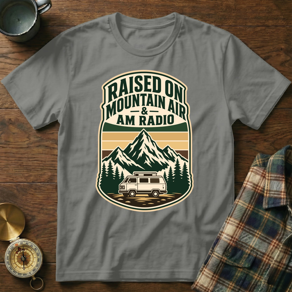 Grey t-shirt with vintage van, mountains, and text "Raised on Mountain Air and AM Radio".
