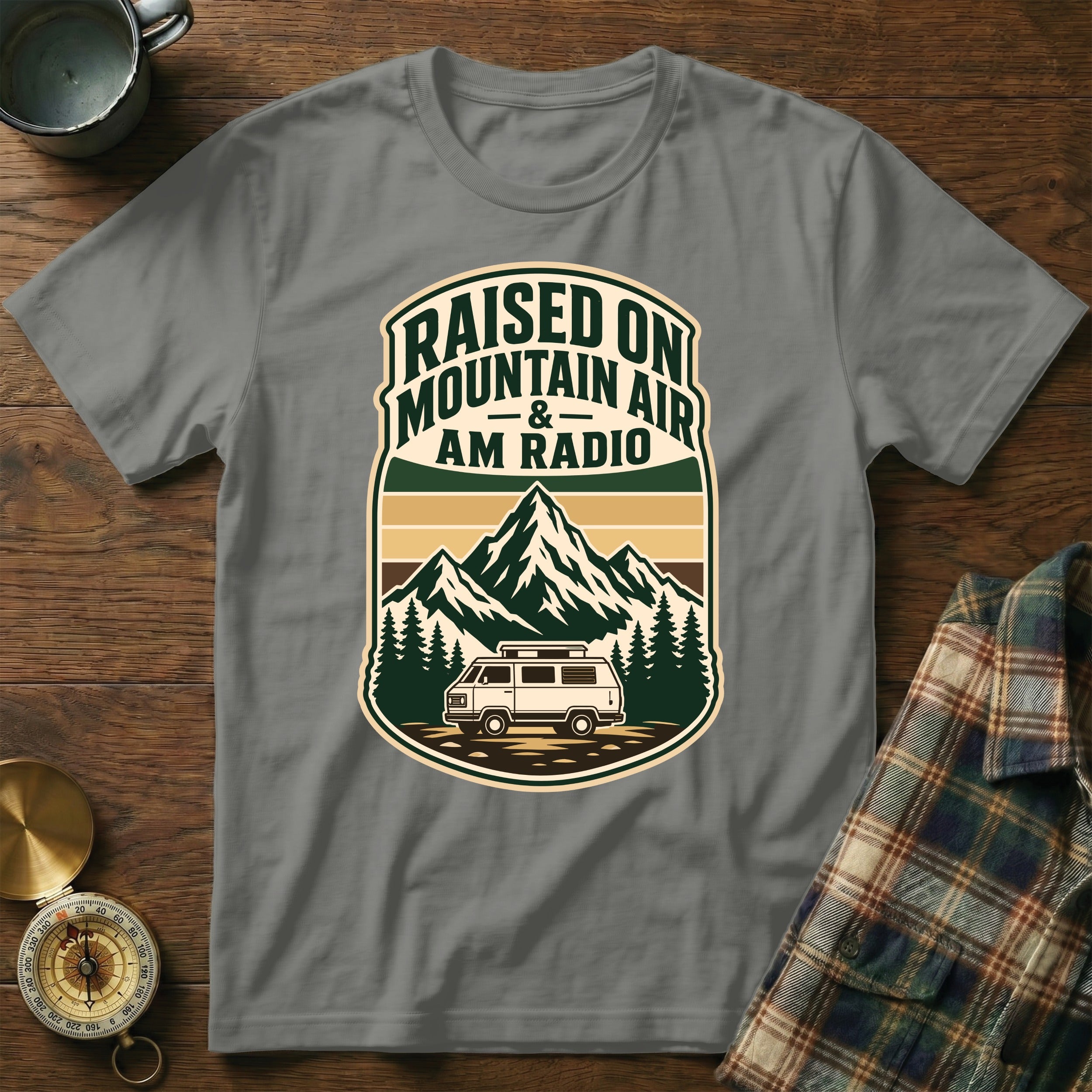 Grey t-shirt with vintage van, mountains, and text "Raised on Mountain Air and AM Radio".