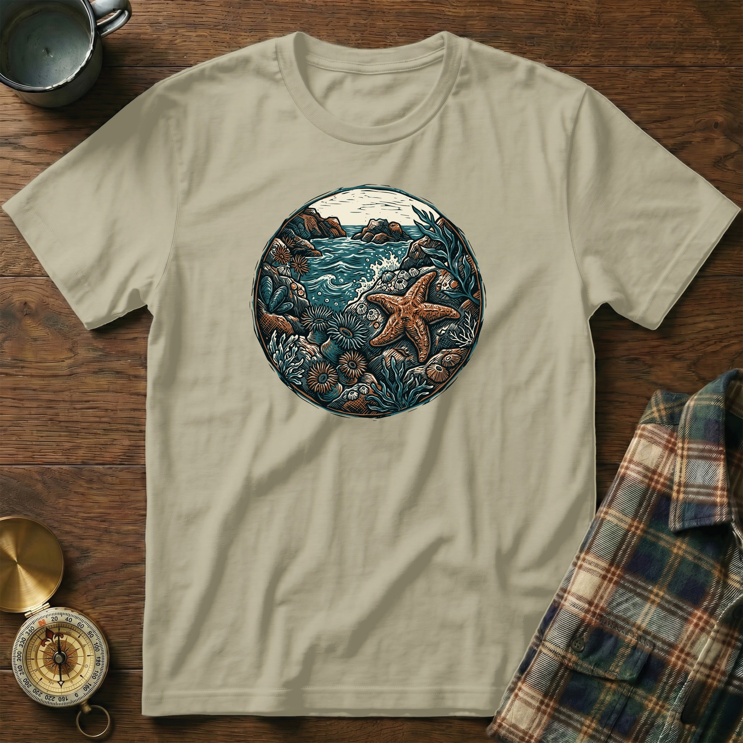 T-shirt with a circular ocean scene featuring a starfish and coral.