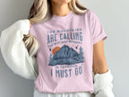 Pink t-shirt with "The mountains are calling, the wifi and internet is terrible, I must go" text.