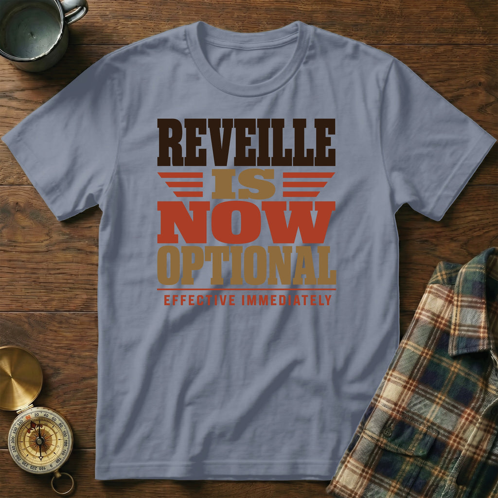 A slate blue t-shirt printed with the text REVEILLE IS NOW OPTIONAL EFFECTIVE IMMEDIATELY.