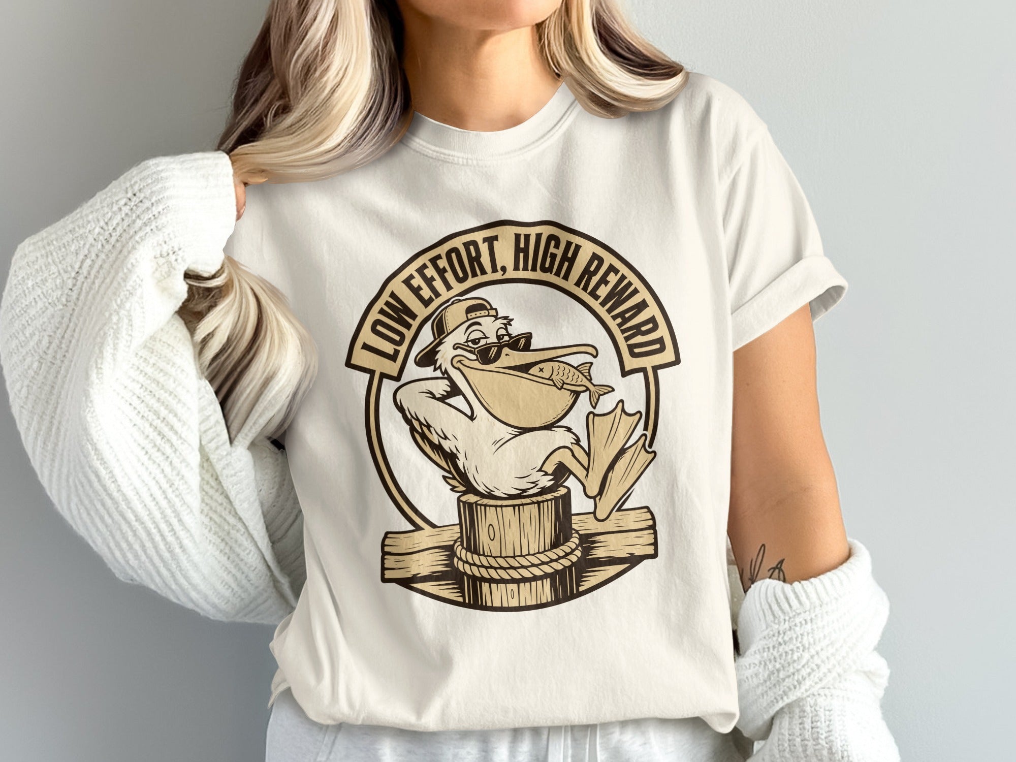 Pelican wearing sunglasses and a hat holding a fish, text reads "Low Effort, High Reward".