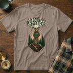 T-shirt with elk graphic and text "WILDERNESS AWAITS" on a mountain.