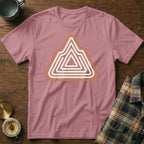 Pink t-shirt with a layered mountain graphic in cream and orange.