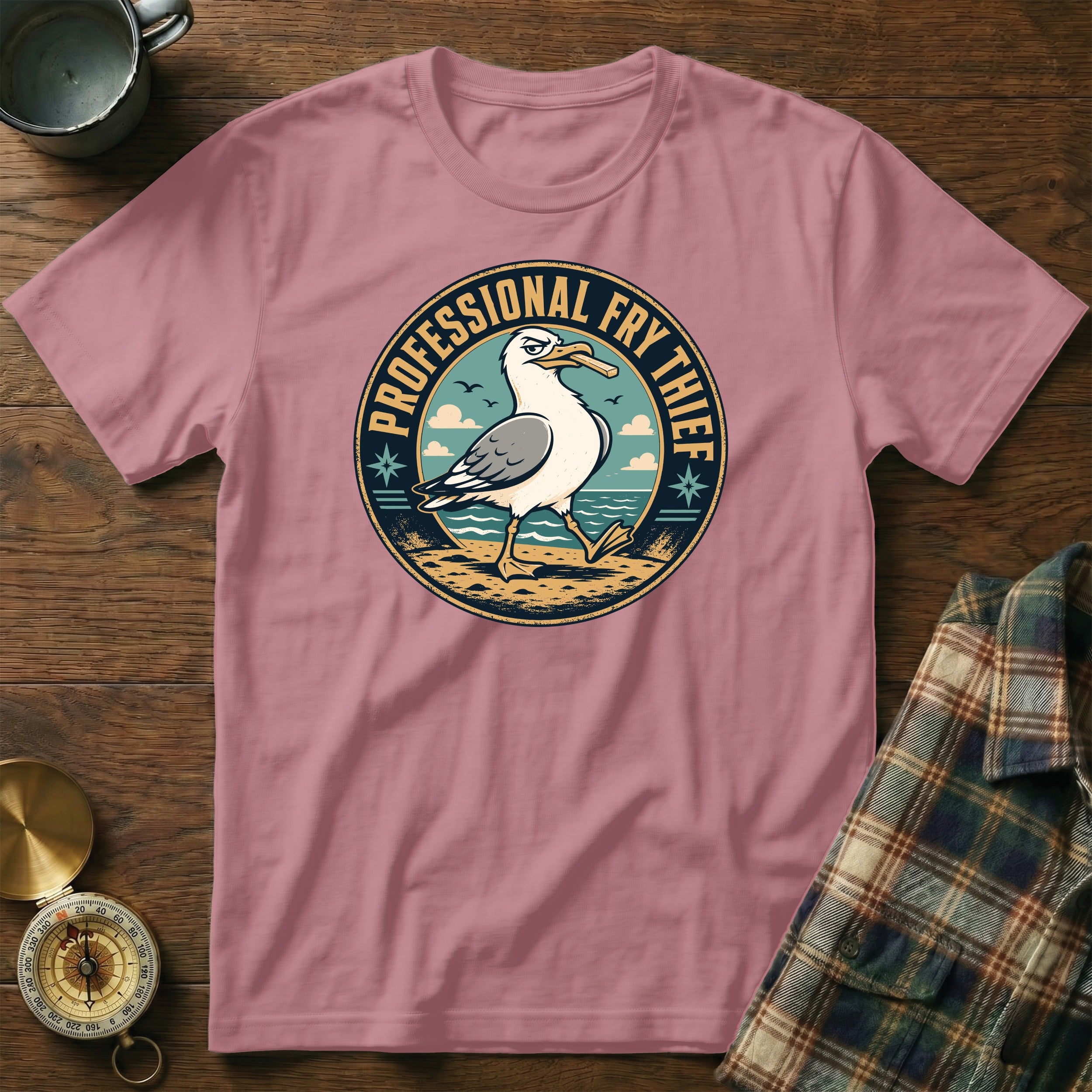 T-shirt with a seagull design that says "Professional Fry Thief"