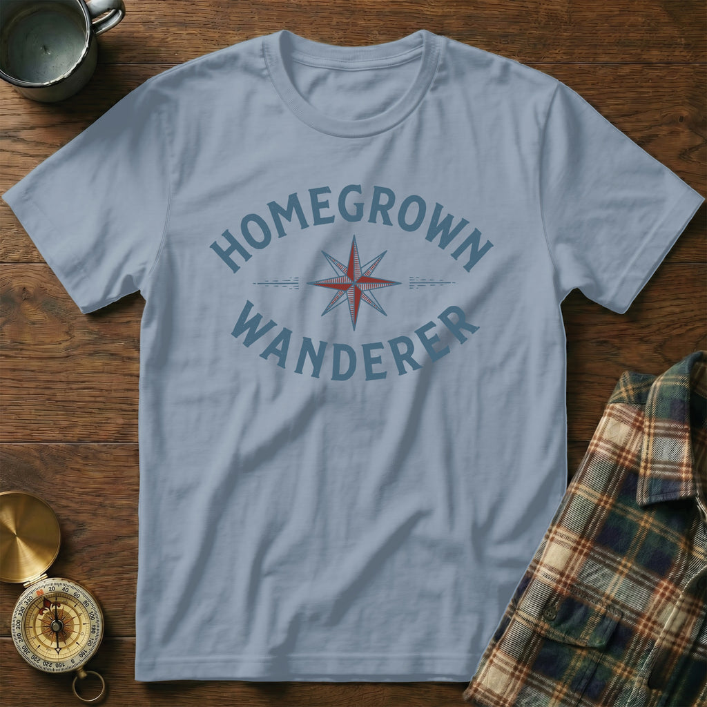 Light blue t-shirt with "HOMEGROWN WANDERER" text and compass graphic.