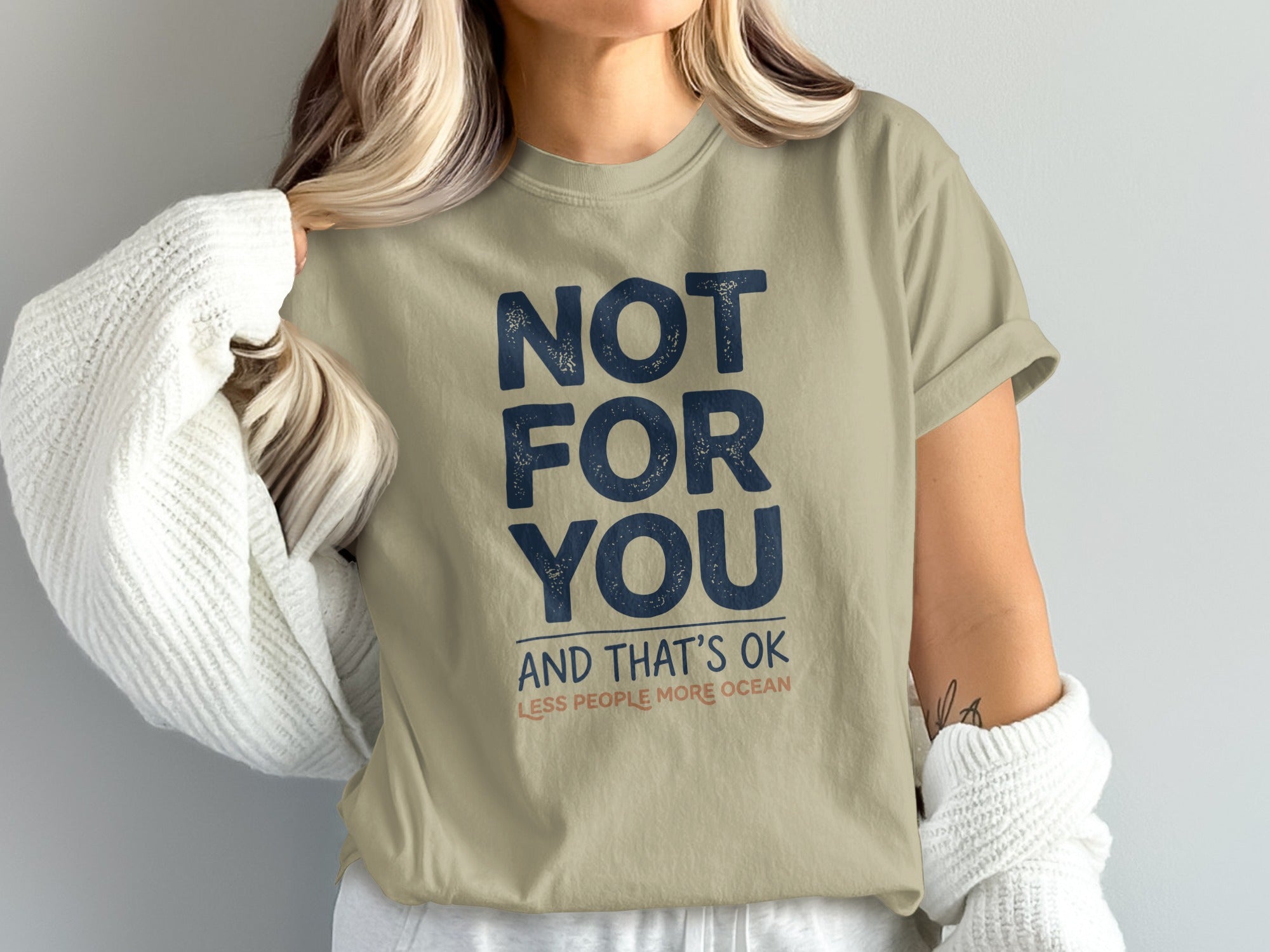 Tan t-shirt with dark blue text reading "NOT FOR YOU AND THAT'S OK LESS PEOPLE MORE OCEAN".