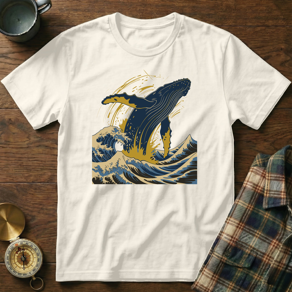 White t-shirt with graphic of a blue whale breaching ocean waves.