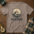 T-shirt with circular wave and vinyl graphic, and "COASTLINE FREQUENCY" text.