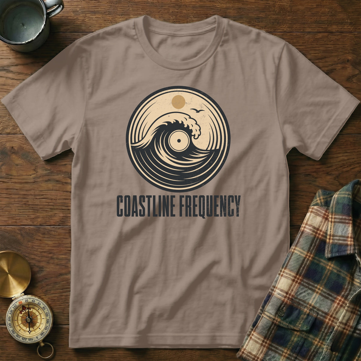T-shirt with circular wave and vinyl graphic, and "COASTLINE FREQUENCY" text.