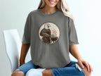 Eagle wearing an apron, grilling at a barbecue, line art graphic on a t-shirt.
