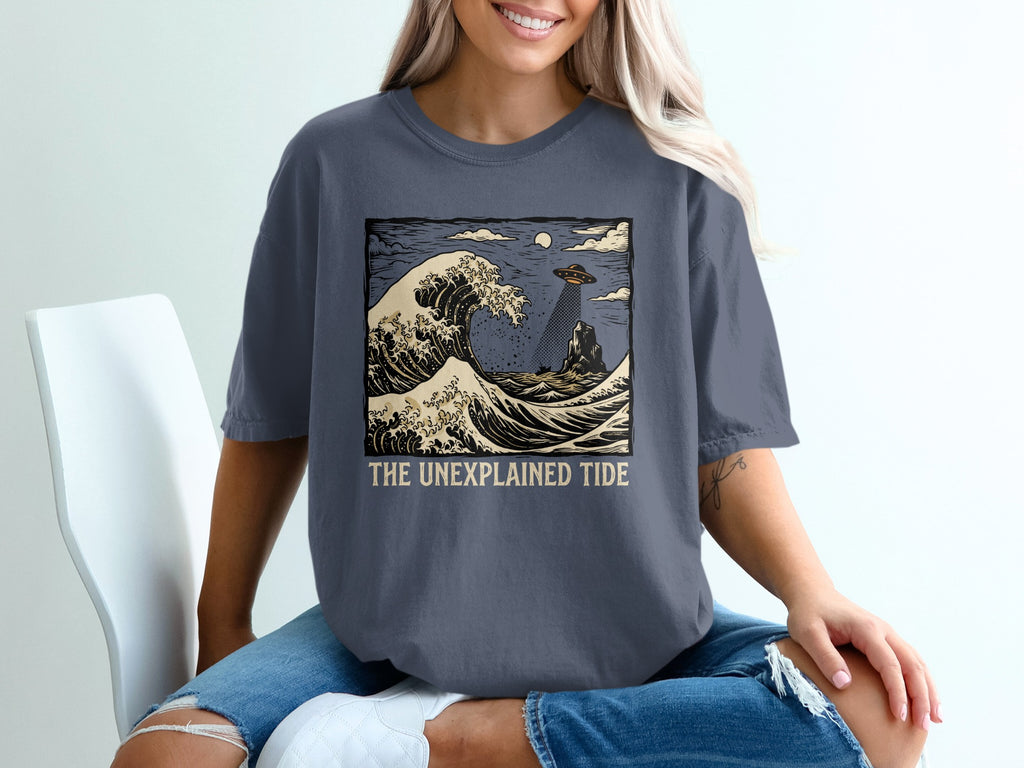 UFO over crashing wave, with "The Unexplained Tide" text.