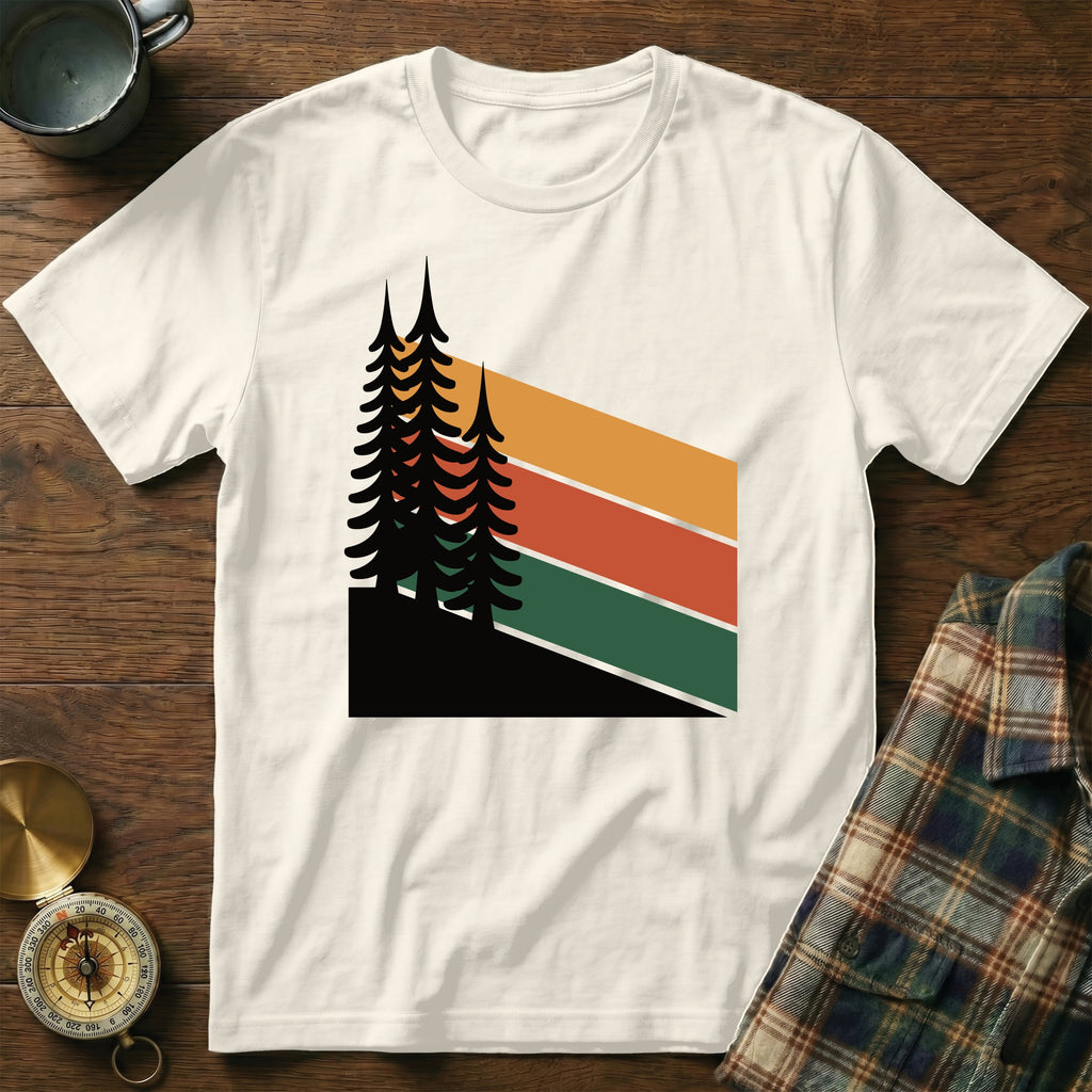 Cream t-shirt with abstract geometric forest design and colorful stripes.