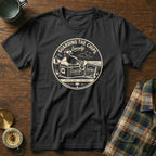 Black t-shirt with graphic of a seagull guarding potato chips on a beach.
