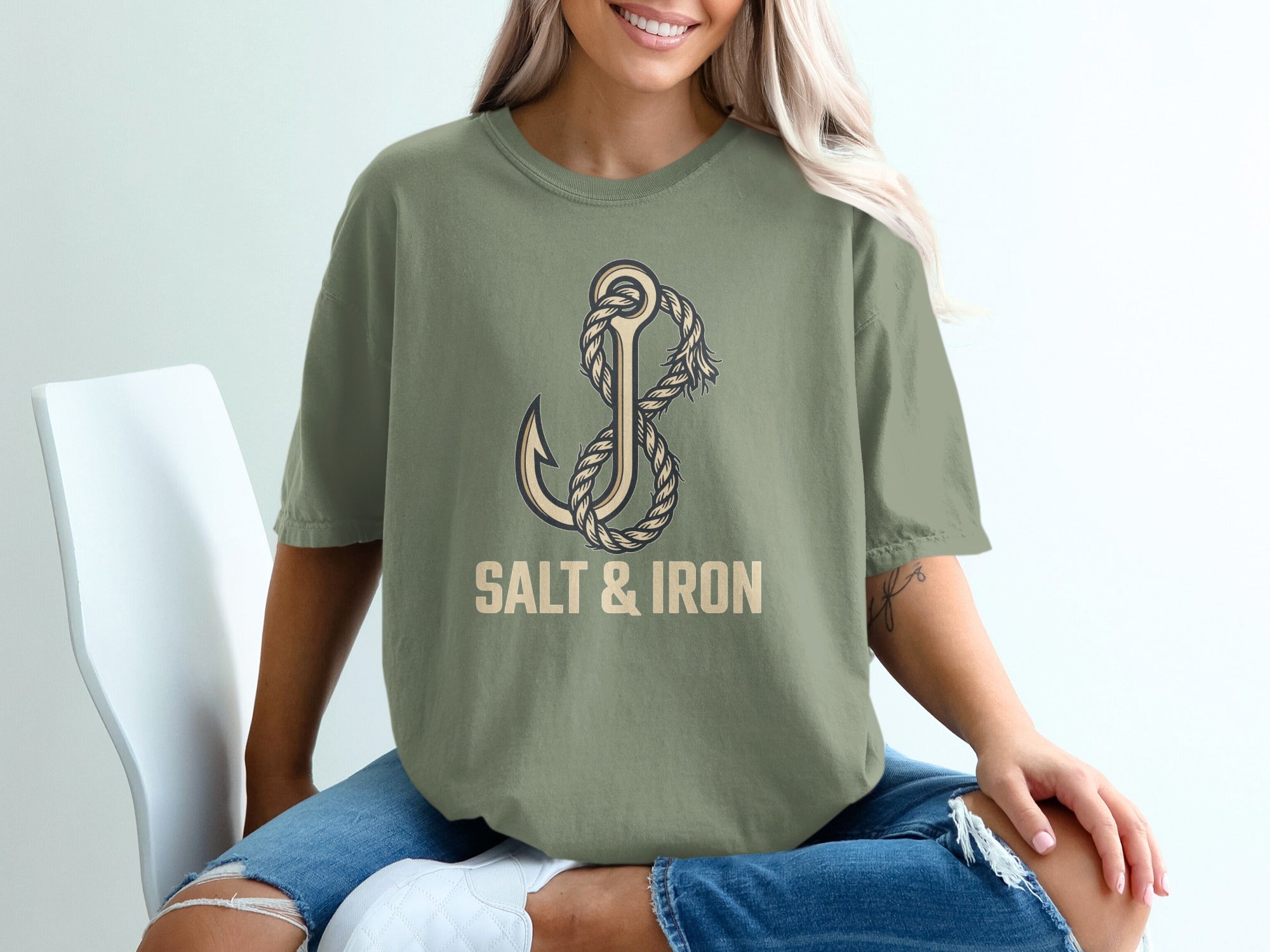 Olive green t-shirt with anchor and rope graphic and "SALT & IRON" text.