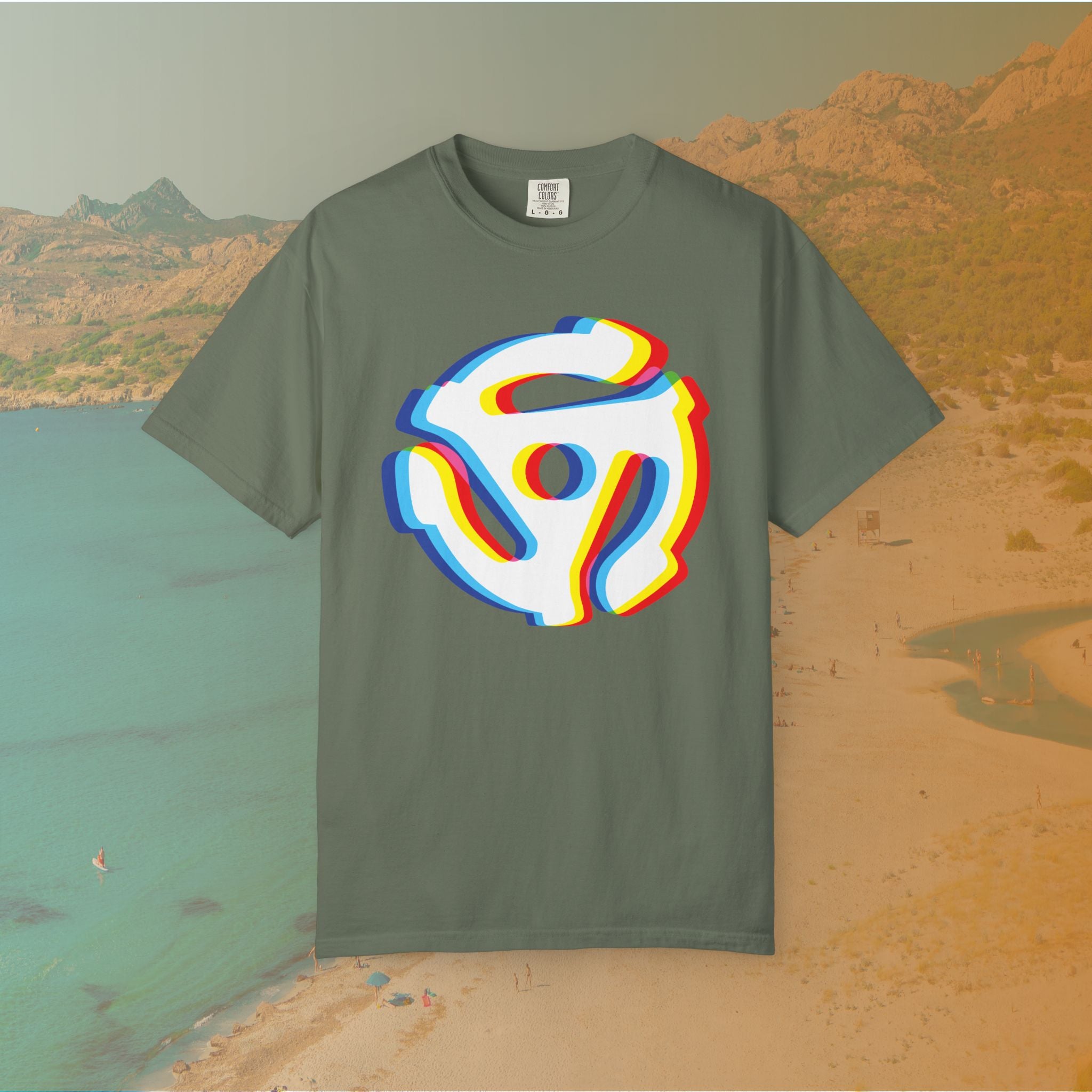 green t-shirt with a graphic of a white 45 RPM vinyl record adapter (dink) with a red, yellow, blue, and cyan chromatic aberration/glitch effect, ready for EDM festival apparel