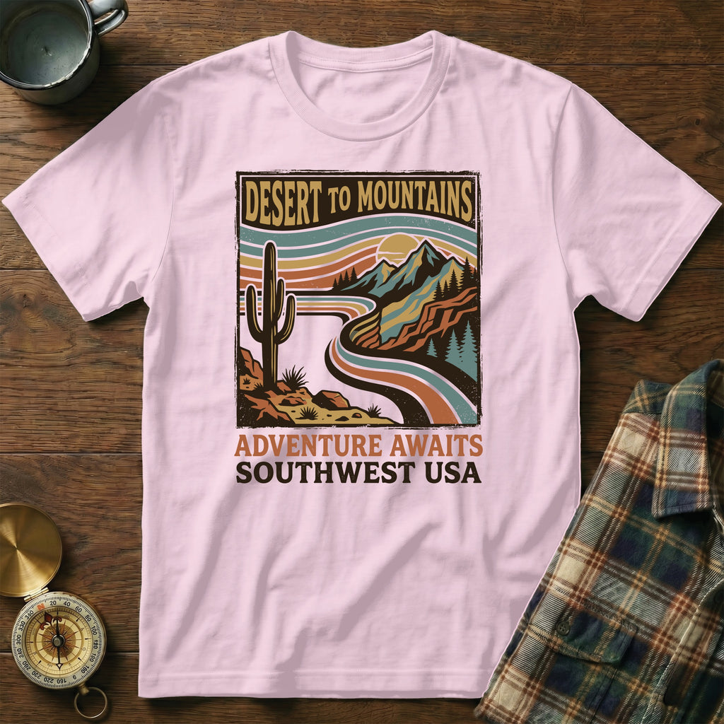 Pink t-shirt with desert mountains graphic and "Adventure Awaits Southwest USA" text.