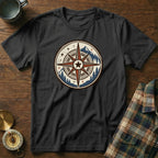 Black t-shirt featuring a distressed compass graphic with mountains and trees.