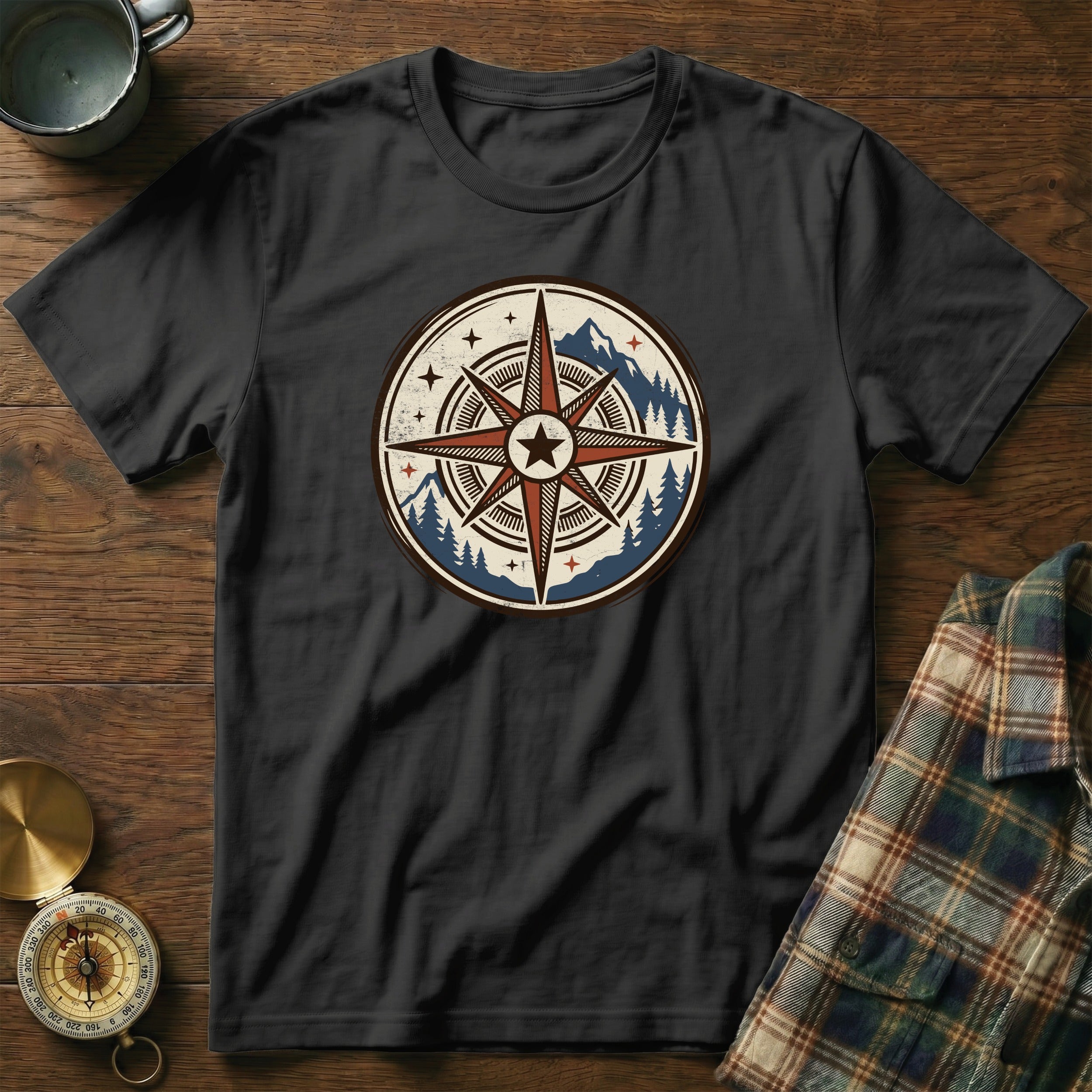 Black t-shirt featuring a distressed compass graphic with mountains and trees.