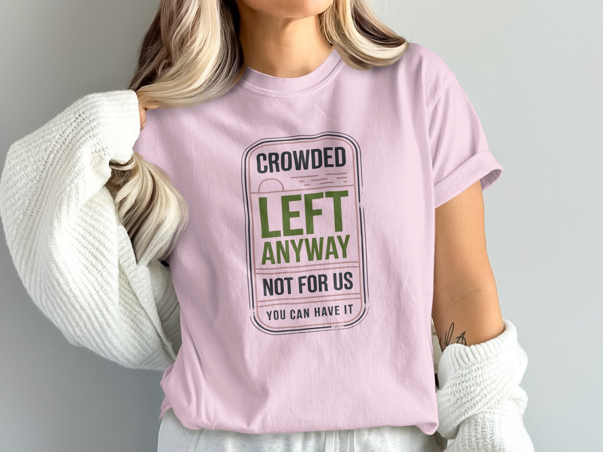 Pink t-shirt with "Crowded Left Anyway, Not For Us. You Can Have It" graphic.