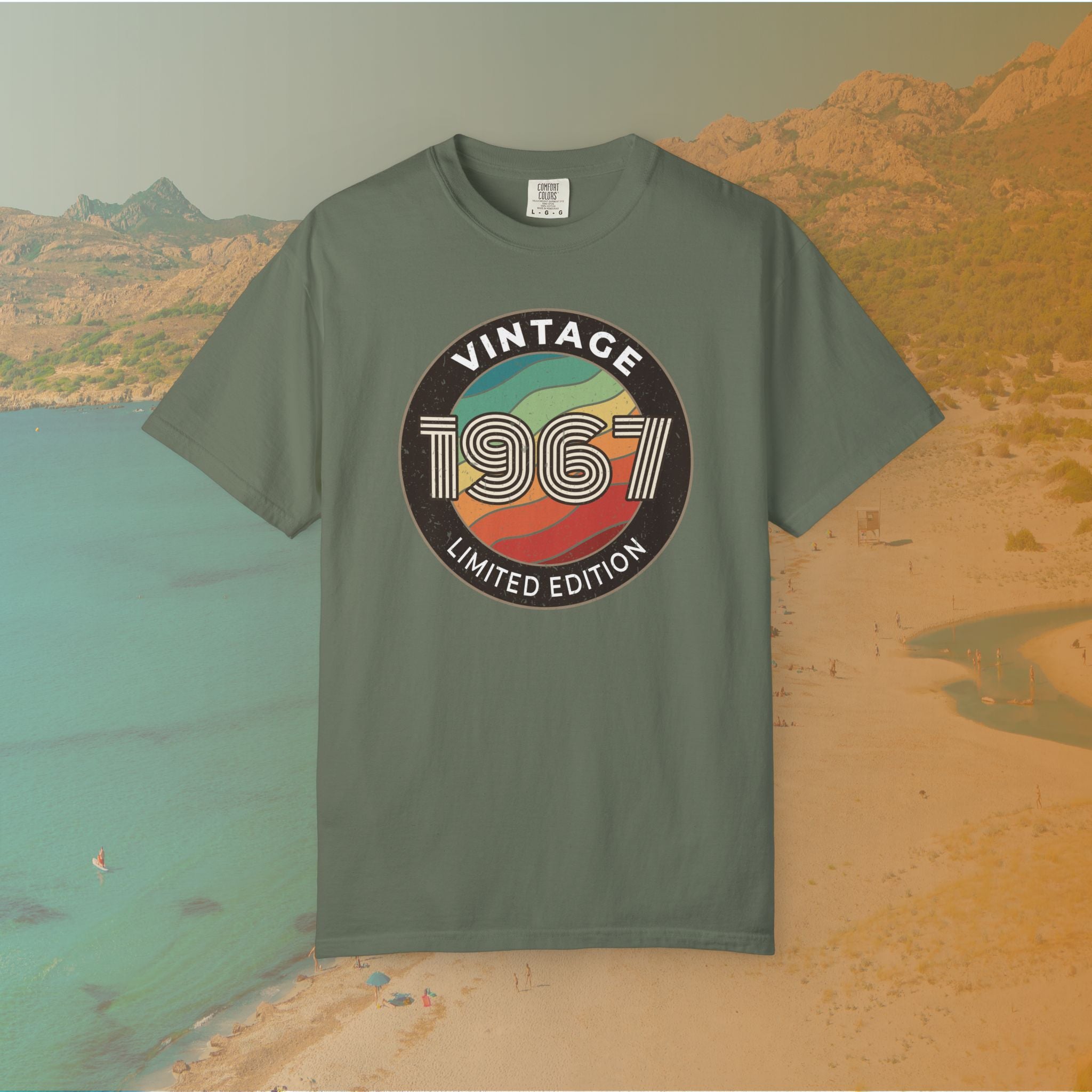 Green t-shirt with 'Vintage 1967 Limited Edition' design on a scenic beach background
