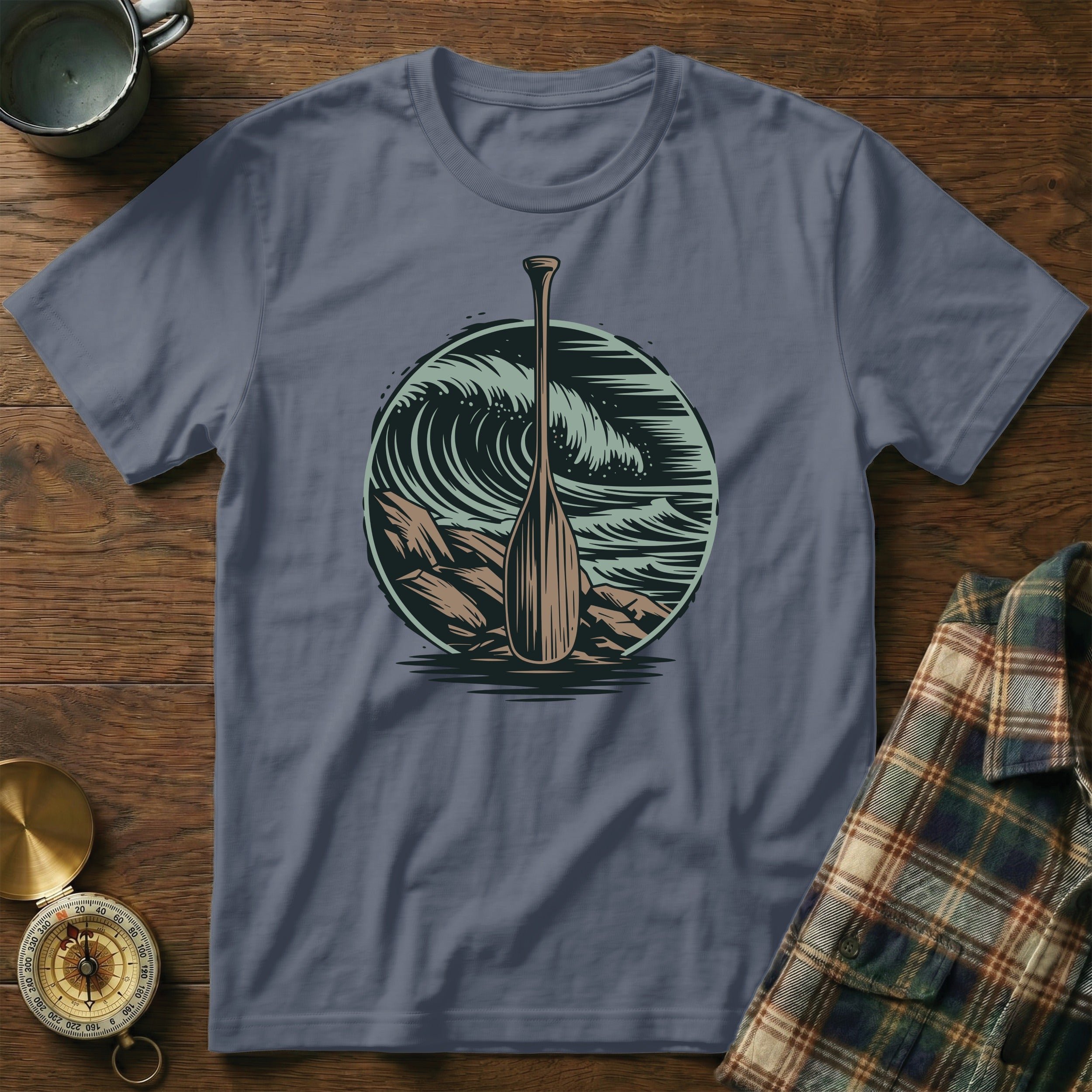 Canoe paddle in a circular wave graphic, on a grey t-shirt.