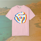 pink t-shirt with a graphic of a white 45 RPM vinyl record adapter (dink) with a red, yellow, blue, and cyan chromatic aberration/glitch effect, ready for EDM festival apparel