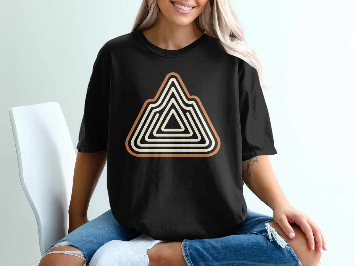 Black t-shirt with a triangular mountain graphic in beige and white stripes.