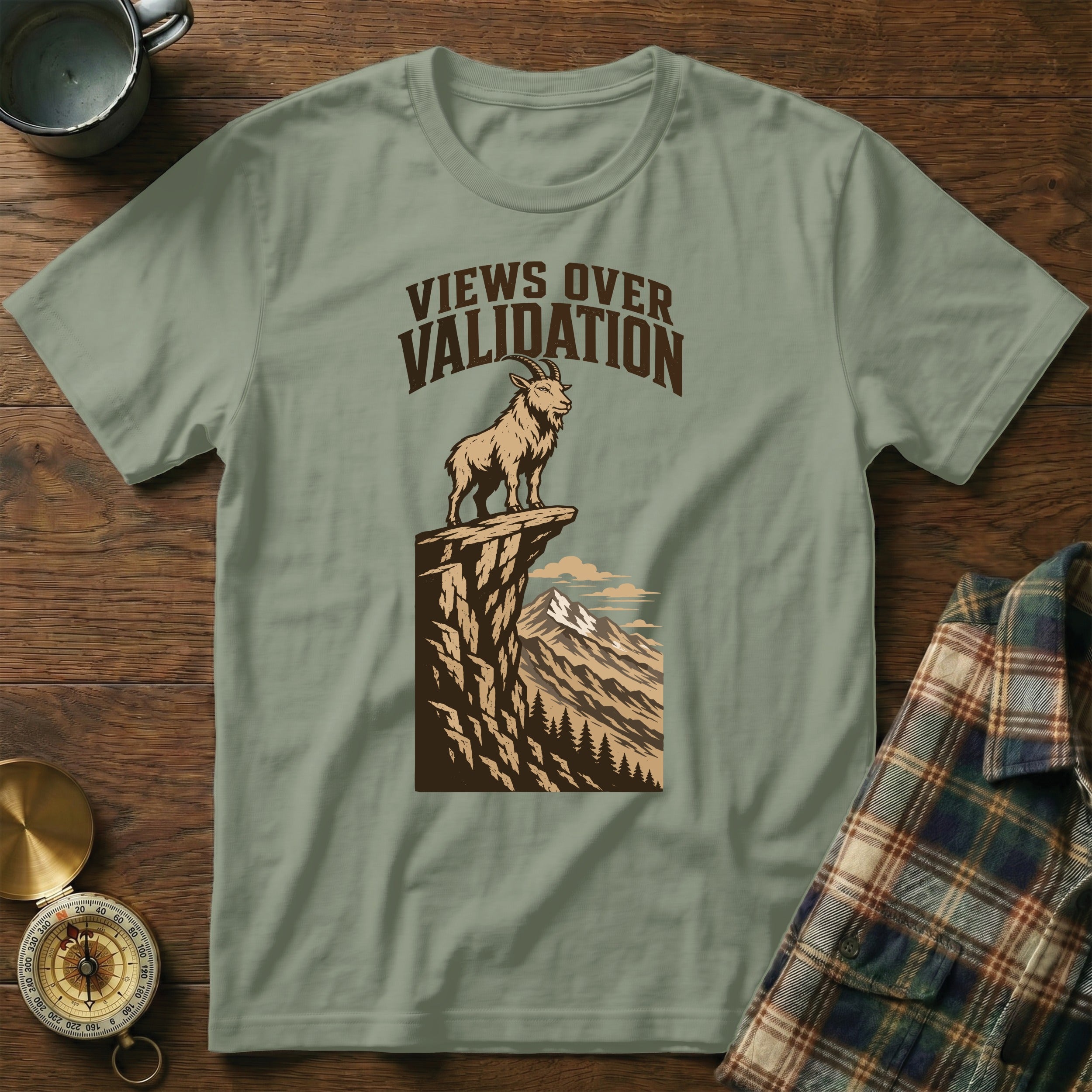 T-shirt with mountain goat graphic and text "VIEWS OVER VALIDATION".