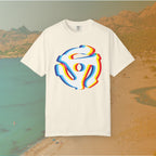 ivory t-shirt with a graphic of a white 45 RPM vinyl record adapter (dink) with a red, yellow, blue, and cyan chromatic aberration/glitch effect, ready for EDM festival apparel