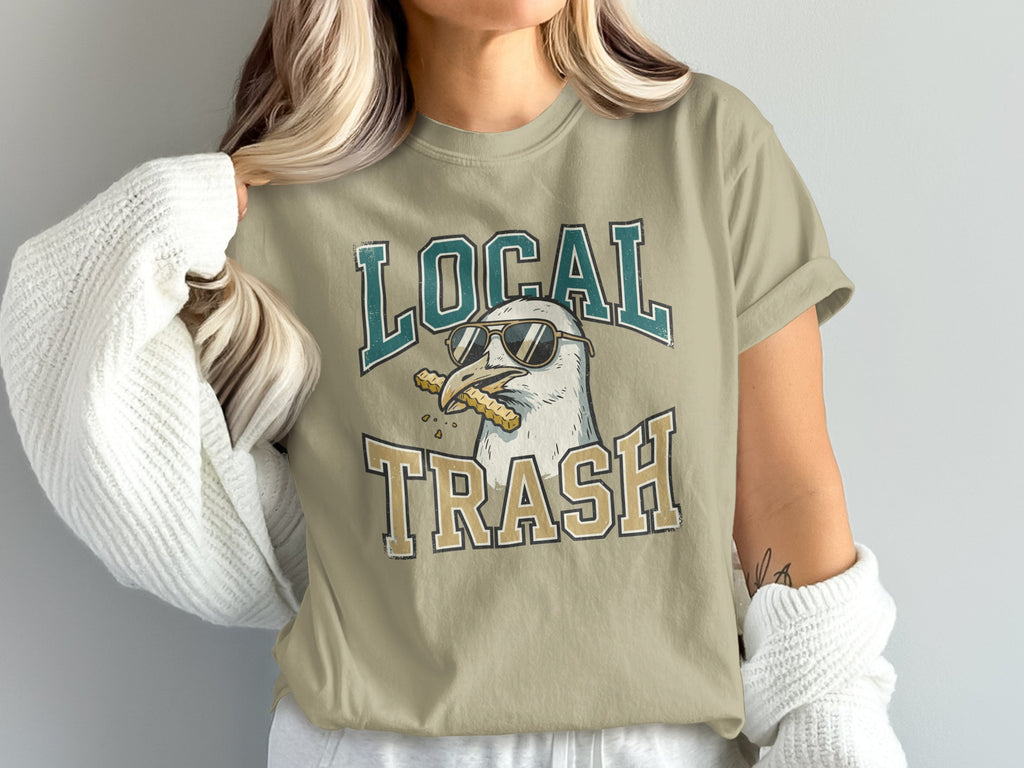 T-shirt with a seagull wearing sunglasses and eating fries.