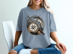 T-shirt graphic with compass, fishing rod, and trout.