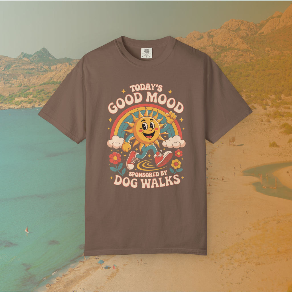 brown  t-shirt Retro 70s-style graphic t-shirt featuring a running, happy cartoon sun in sneakers under a rainbow and clouds. The slogan reads: "TODAY'S GOOD MOOD SPONSORED BY DOG WALKS."