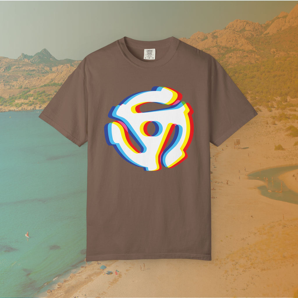 brown t-shirt with a graphic of a white 45 RPM vinyl record adapter (dink) with a red, yellow, blue, and cyan chromatic aberration/glitch effect, ready for EDM festival apparel