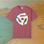 maroon t-shirt with a graphic of a white 45 RPM vinyl record adapter (dink) with a red, yellow, blue, and cyan chromatic aberration/glitch effect, ready for EDM festival apparel