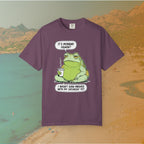 purple t-shirt Funny T-shirt graphic featuring a large, grumpy toad holding a to-go coffee cup. The cartoon is captioned with the quotes: "IT'S MONDAY AGAIN? I WASN'T EVEN FINISHED WITH MY SATURDAY YET.