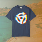 navy blue t-shirt with a graphic of a white 45 RPM vinyl record adapter (dink) with a red, yellow, blue, and cyan chromatic aberration/glitch effect, ready for EDM festival apparel