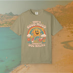 green  t-shirt Retro 70s-style graphic t-shirt featuring a running, happy cartoon sun in sneakers under a rainbow and clouds. The slogan reads: "TODAY'S GOOD MOOD SPONSORED BY DOG WALKS."