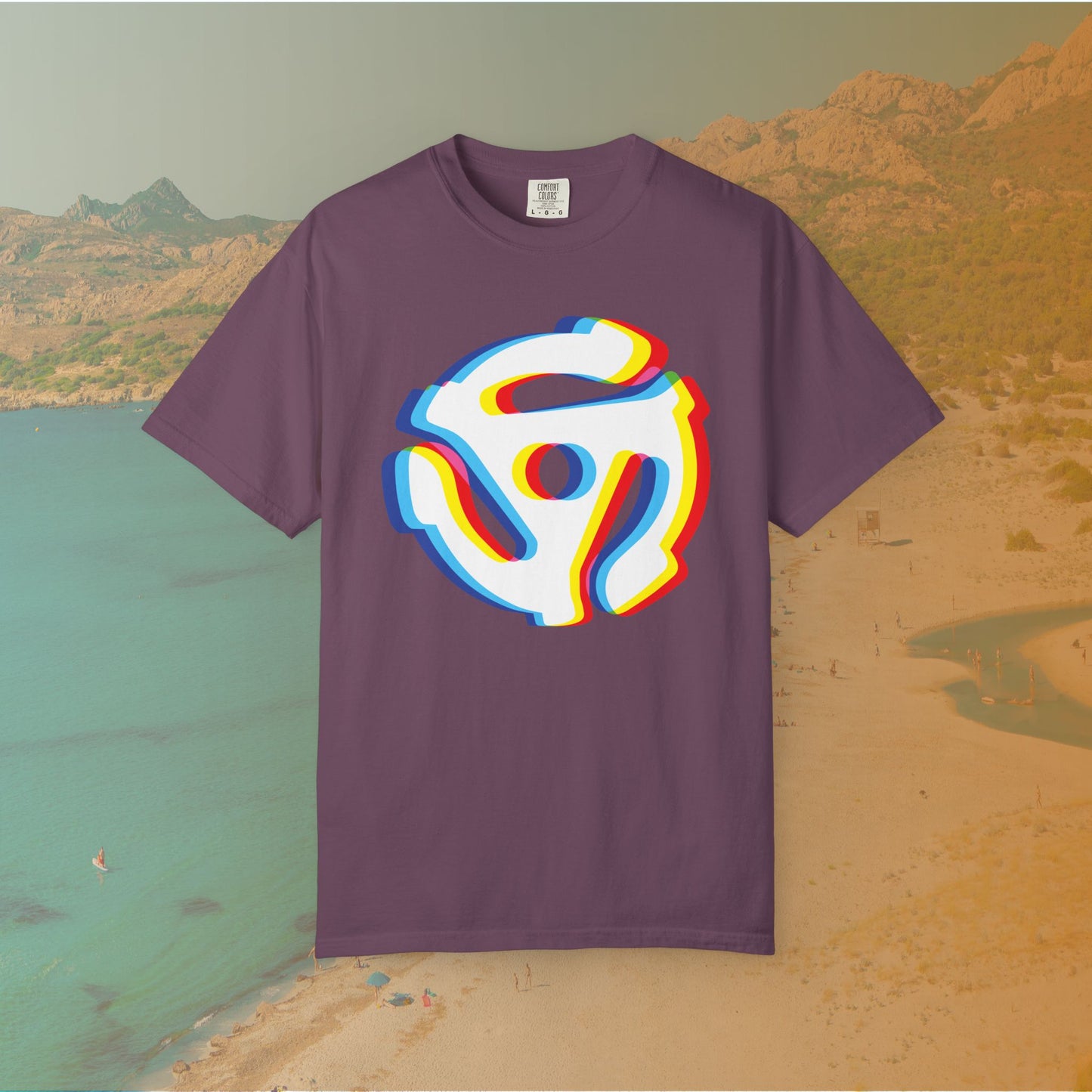purple t-shirt with a graphic of a white 45 RPM vinyl record adapter (dink) with a red, yellow, blue, and cyan chromatic aberration/glitch effect, ready for EDM festival apparel