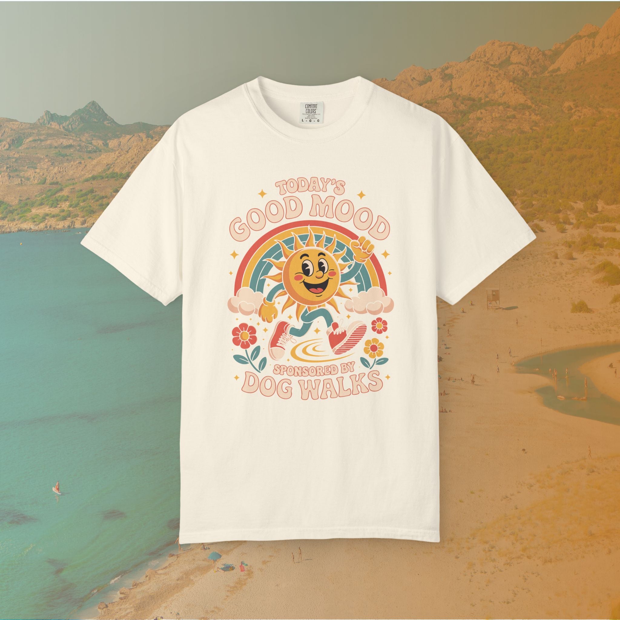 ivory  t-shirt Retro 70s-style graphic t-shirt featuring a running, happy cartoon sun in sneakers under a rainbow and clouds. The slogan reads: "TODAY'S GOOD MOOD SPONSORED BY DOG WALKS."