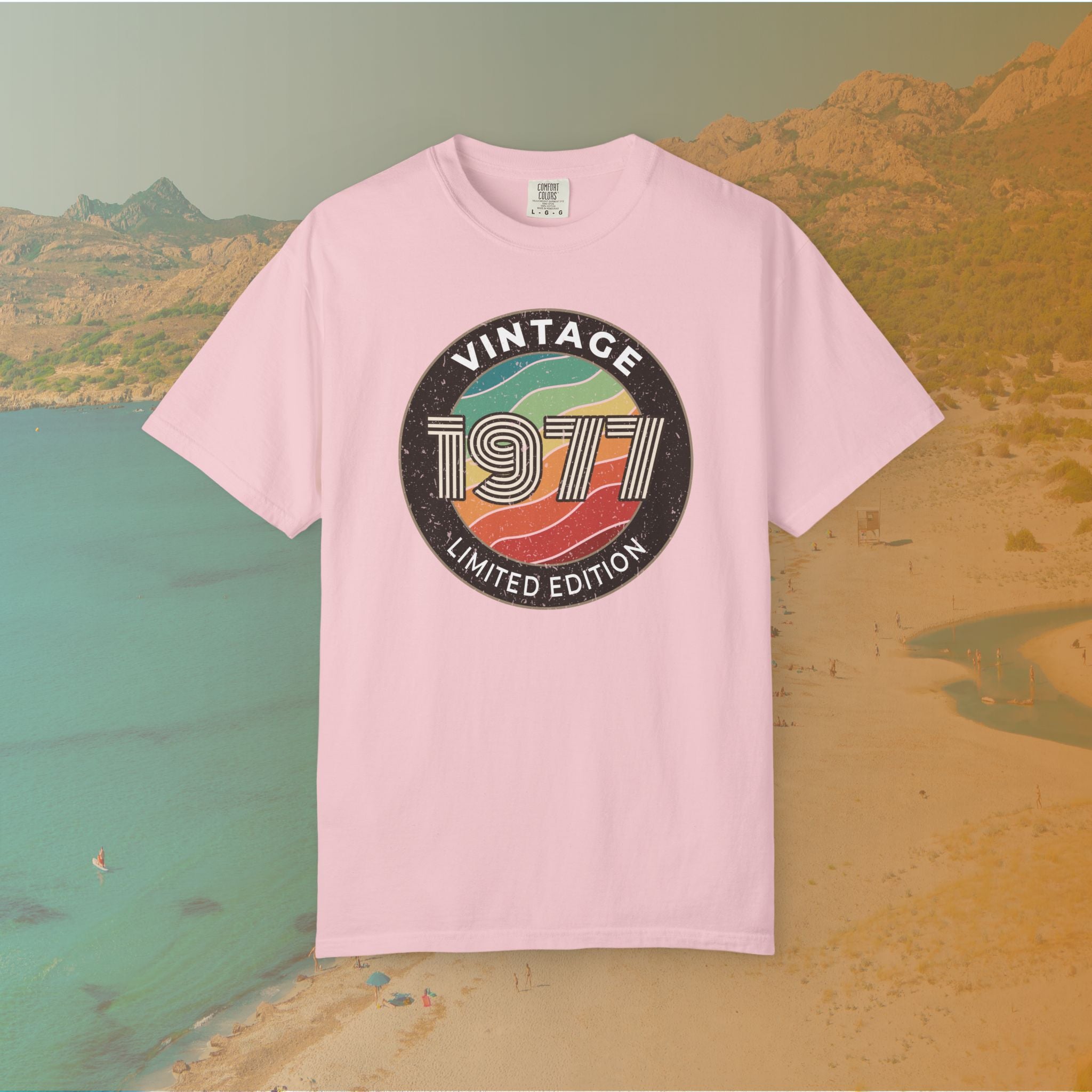 Pink Retro-style circular graphic featuring the year 1977 in a bold, lined font over a distressed, multi-colored wavy background. The outer border reads "VINTAGE" at the top and "LIMITED EDITION" at the bottom. 