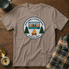 T-shirt graphic with retro cassette tape, campfire, trees, and "Adventure Awaits" text.