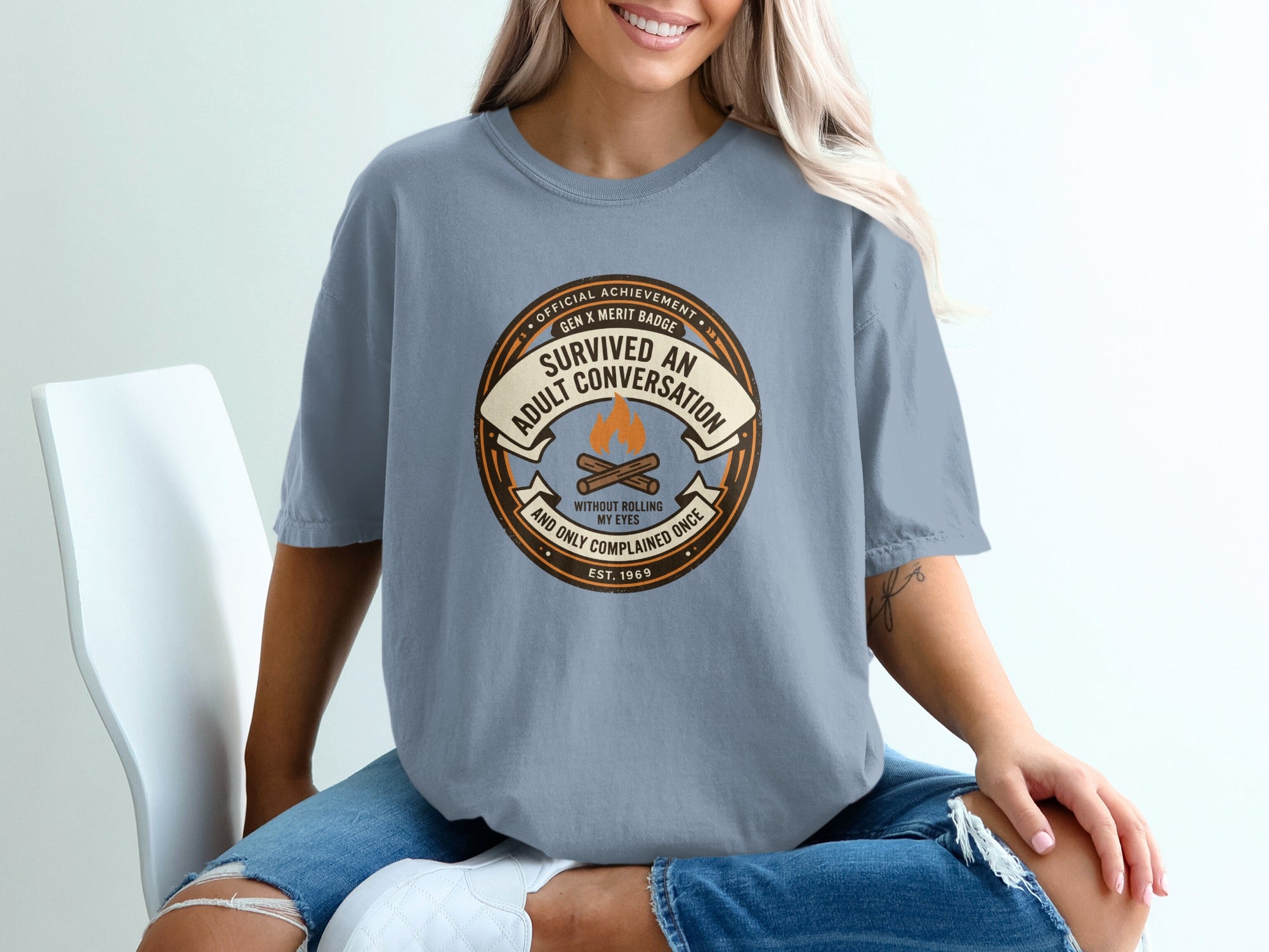 T-shirt with "Survived an adult conversation without rolling my eyes" text.