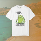 Funny T-shirt graphic featuring a large, grumpy toad holding a to-go coffee cup. The cartoon is captioned with the quotes: "IT'S MONDAY AGAIN? I WASN'T EVEN FINISHED WITH MY SATURDAY YET.