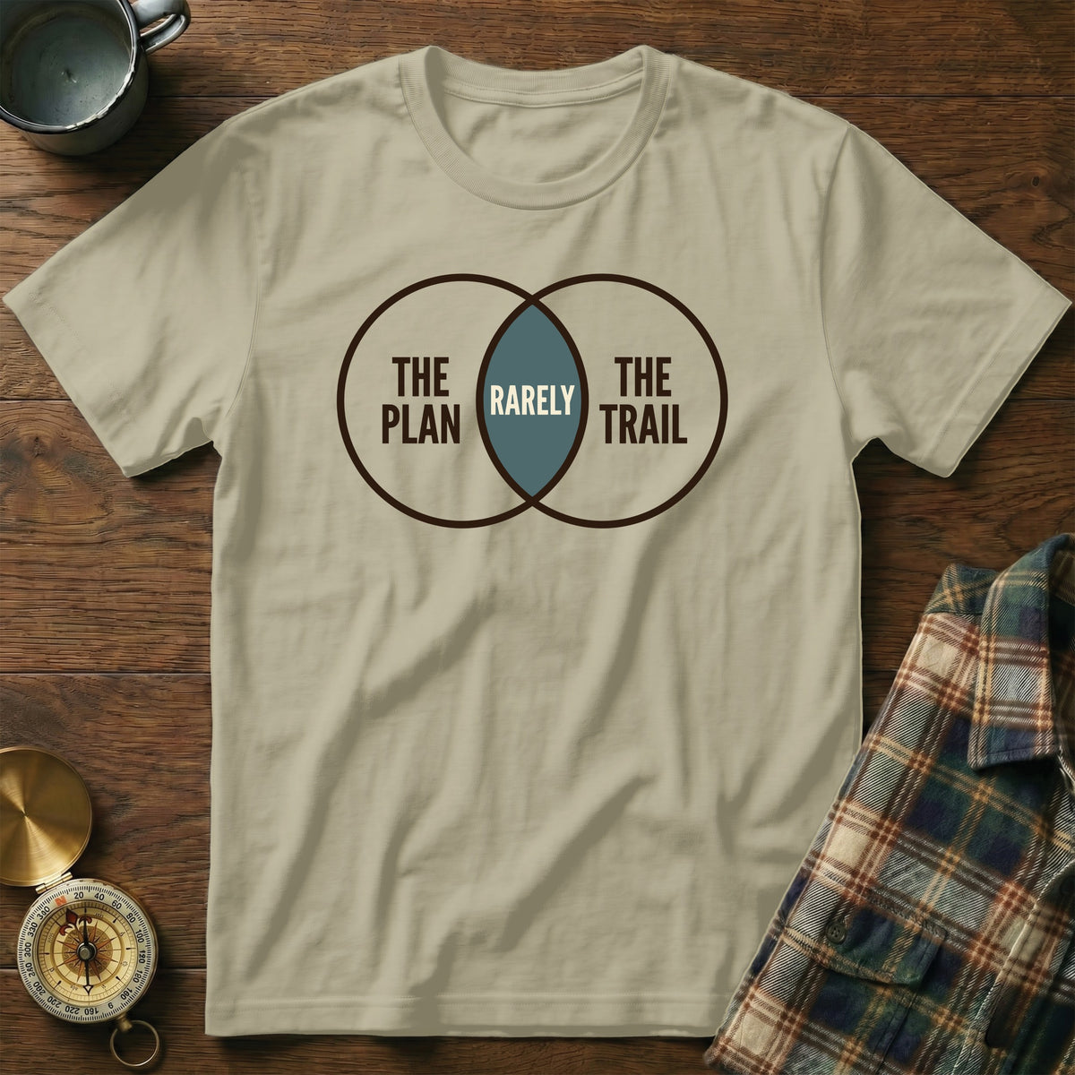 T-shirt with Venn diagram graphic: "The Plan", "The Trail", and "Rarely" in overlap.