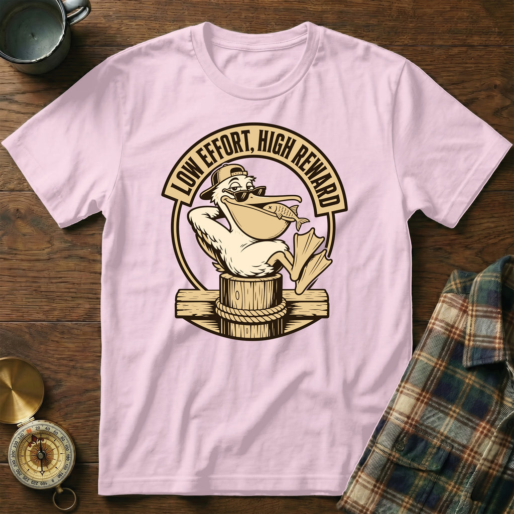 Pink t-shirt with cartoon pelican holding a fish and text "LOW EFFORT, HIGH REWARD".